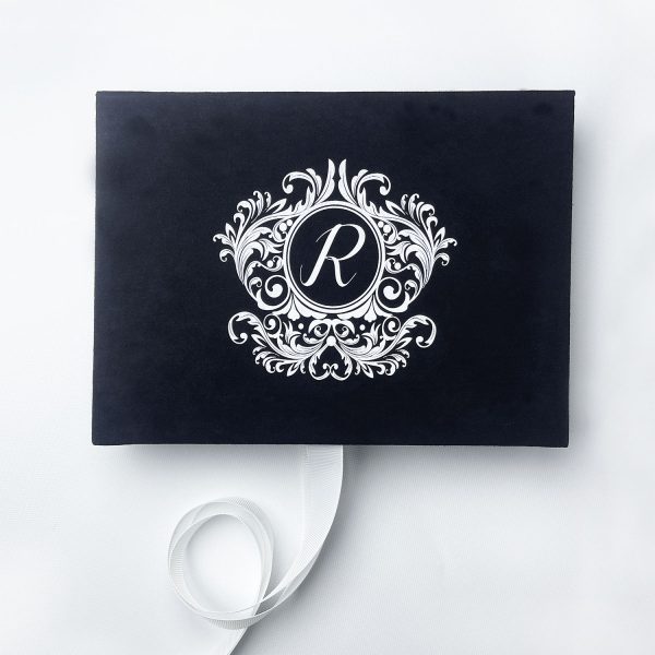 Black velvet invitation box with white monogram